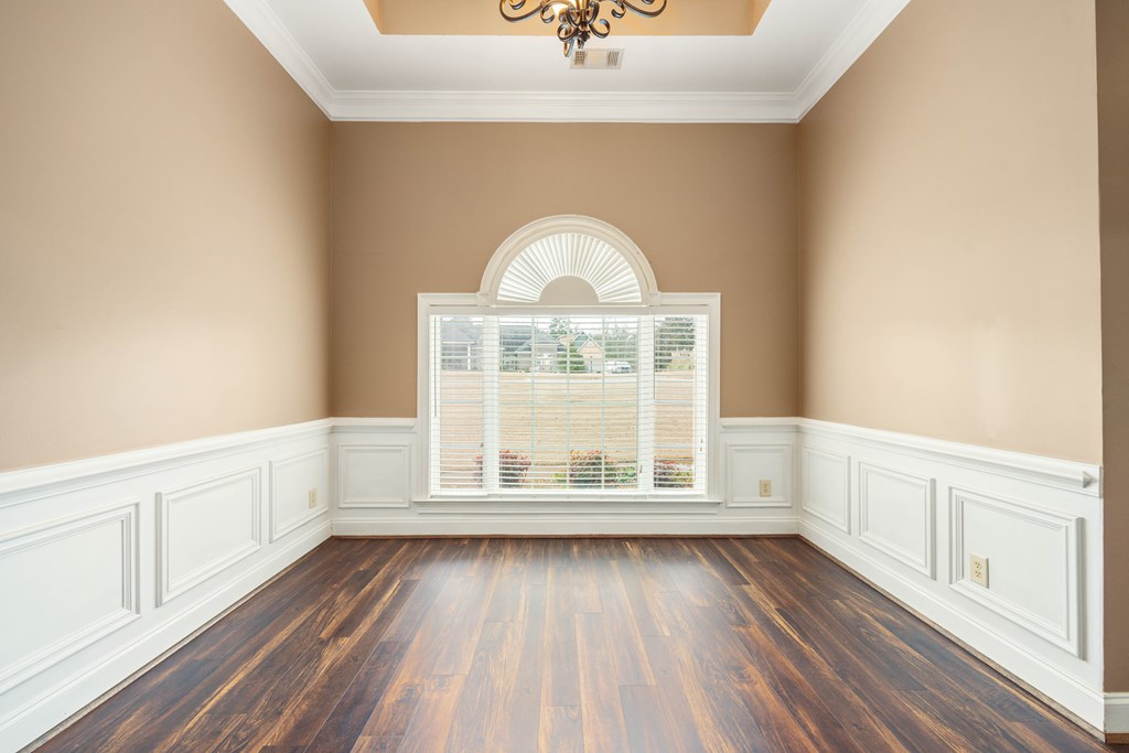 235 Voorhees Road Hamilton, GA 31811 - Photo 21 of 36 a view of an empty room with wooden floor and a window