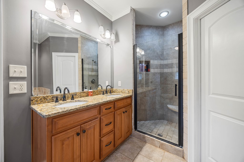 235 Voorhees Road Hamilton, GA 31811 - Photo 23 of 36 a bathroom with a shower sink and mirror