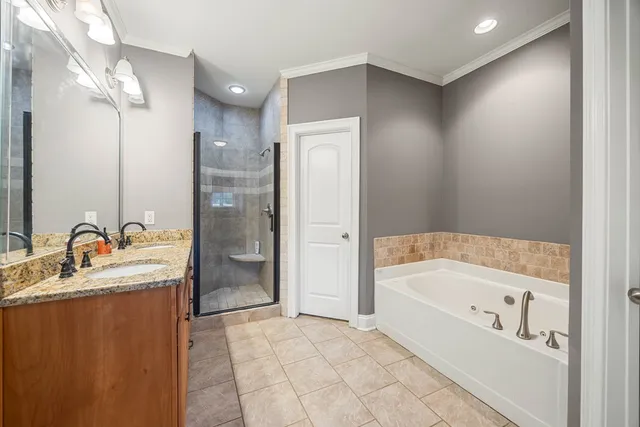 a bathroom with a bathtub and toilet