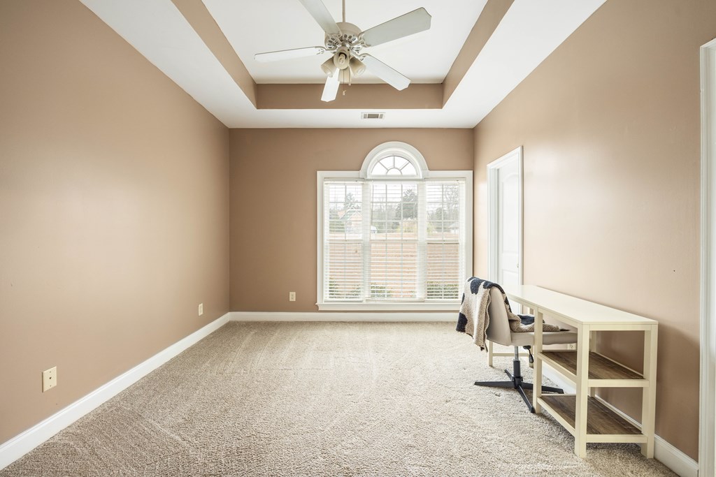 235 Voorhees Road Hamilton, GA 31811 - Photo 29 of 36 an empty room with a window and ceiling fan