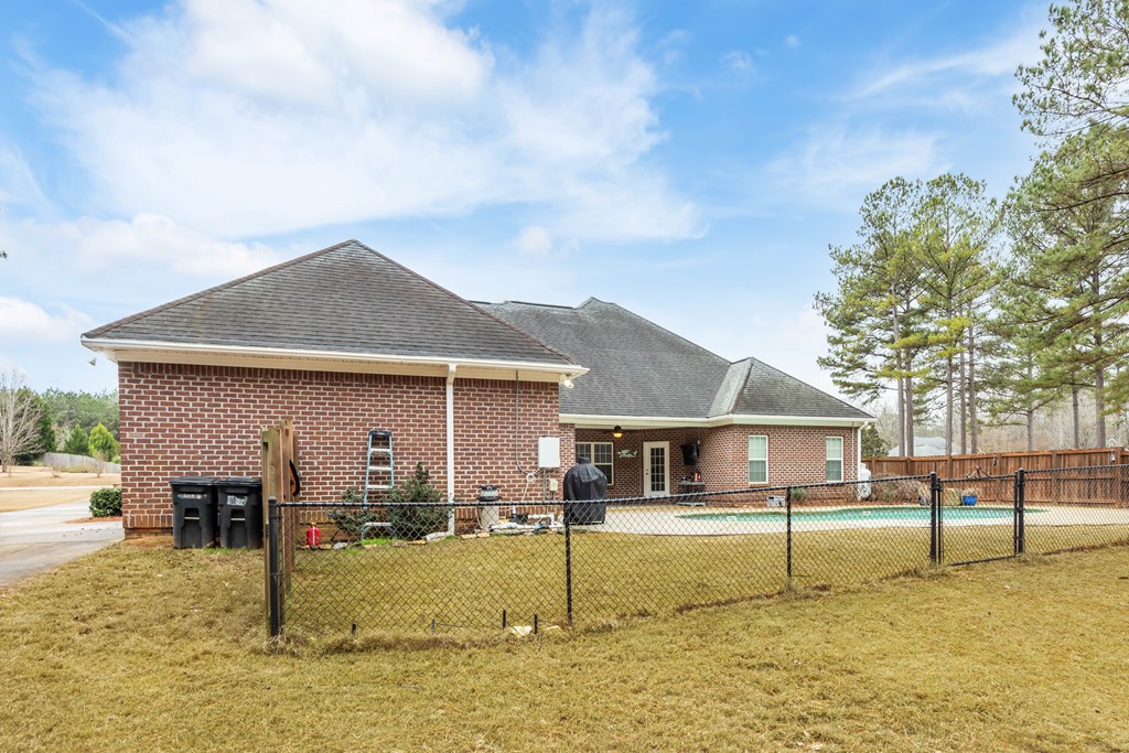 235 Voorhees Road Hamilton, GA 31811 - Photo 34 of 36 a front view of a house with a yard