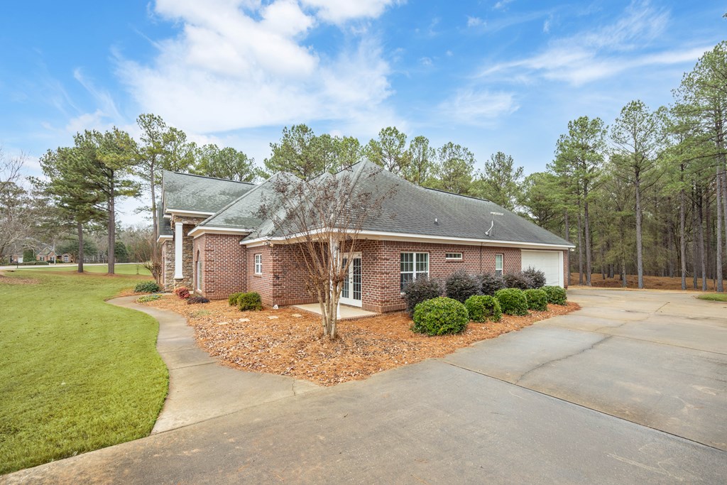 235 Voorhees Road Hamilton, GA 31811 - Photo 4 of 36 a front view of a house with garden