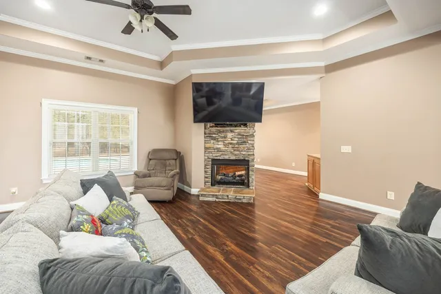 a living room with furniture and a fireplace
