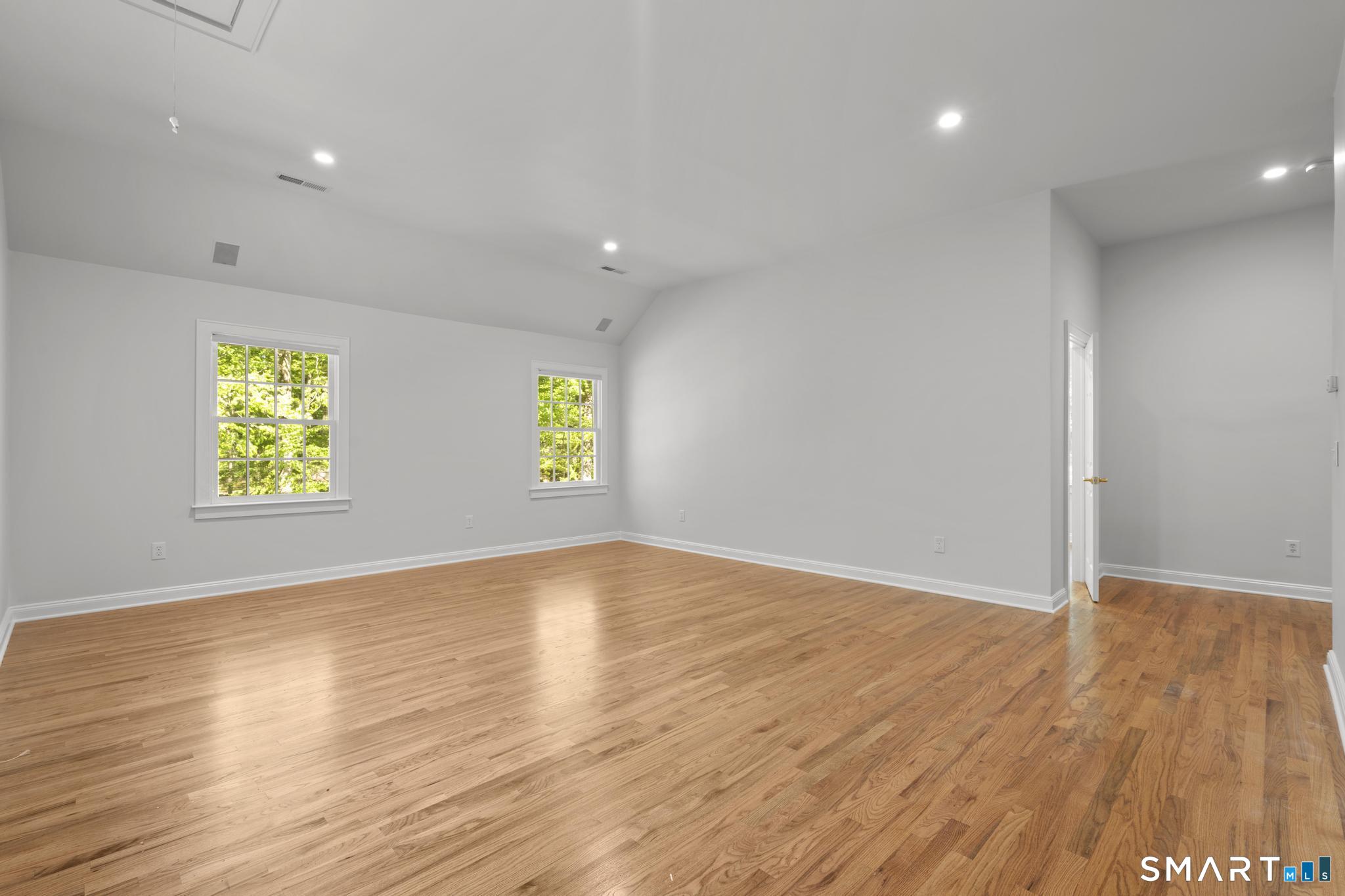 181 Old Branchville Road Ridgefield, CT 06877 - Photo 17 of 40 an empty room with wooden floor and windows