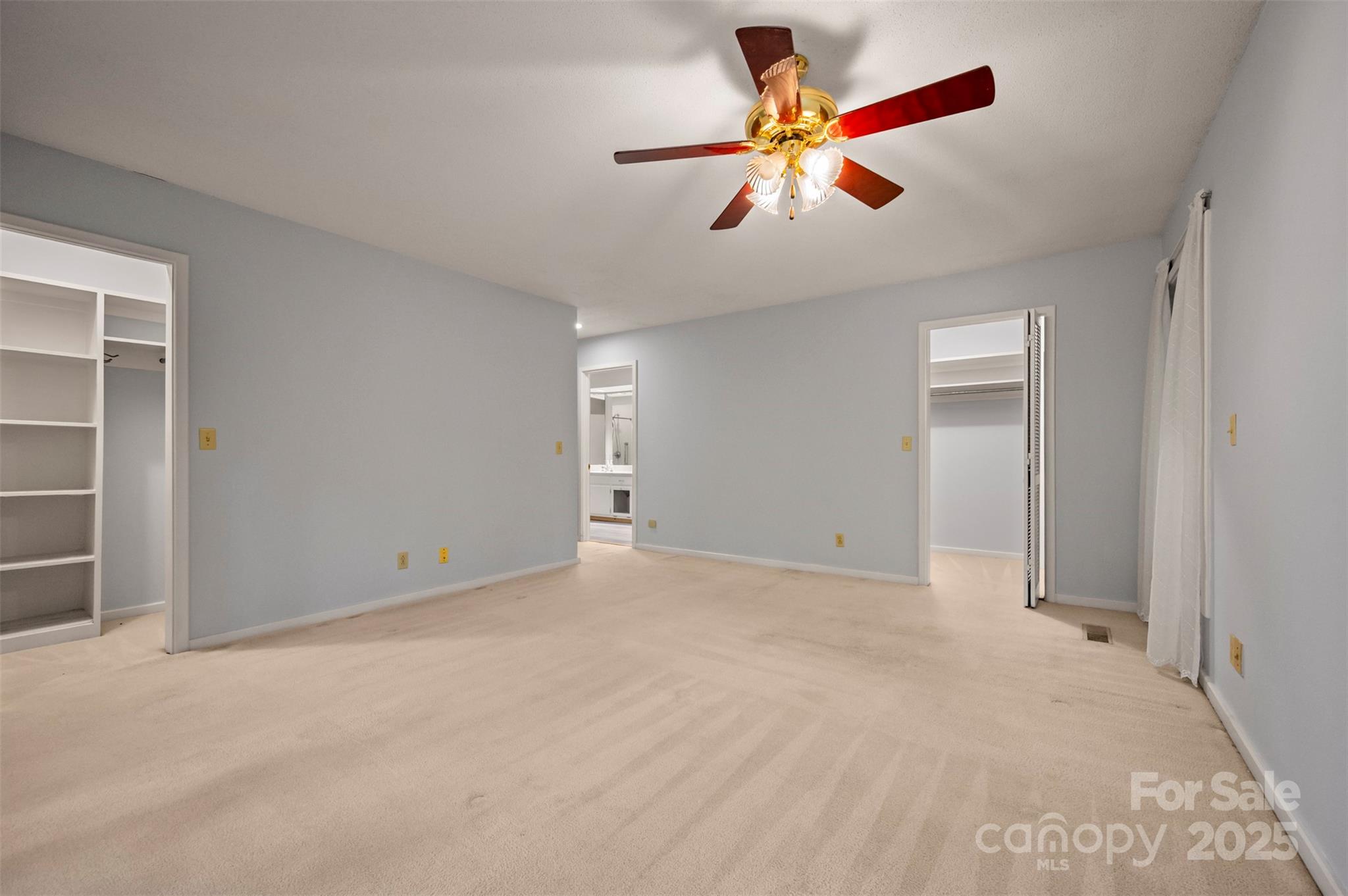 106 Bluebird Lane Tryon, NC 28782 - Photo 14 of 26 an empty room with closet and fan