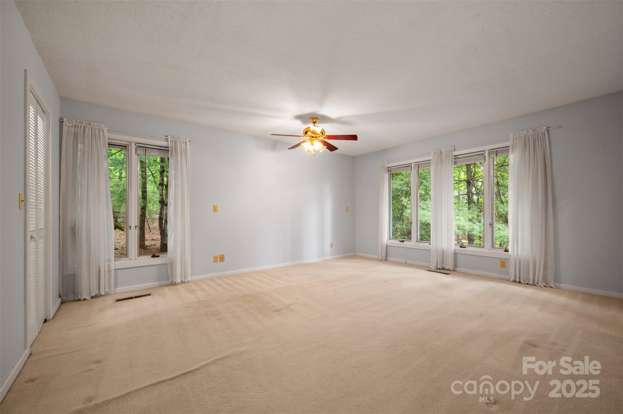 106 Bluebird Lane Tryon, NC 28782 - Photo 15 of 26 a view of a livingroom with a ceiling fan and window