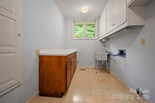 a view of a room with wooden floor and staircase
