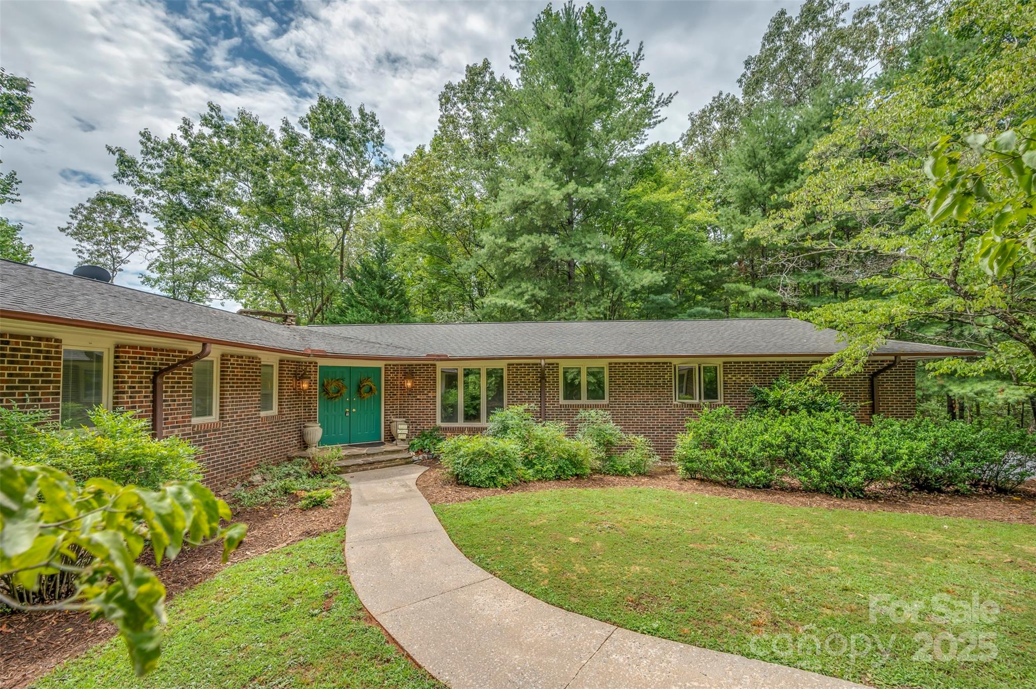 106 Bluebird Lane Tryon, NC 28782 - Photo 2 of 26 front view of a house with a yard