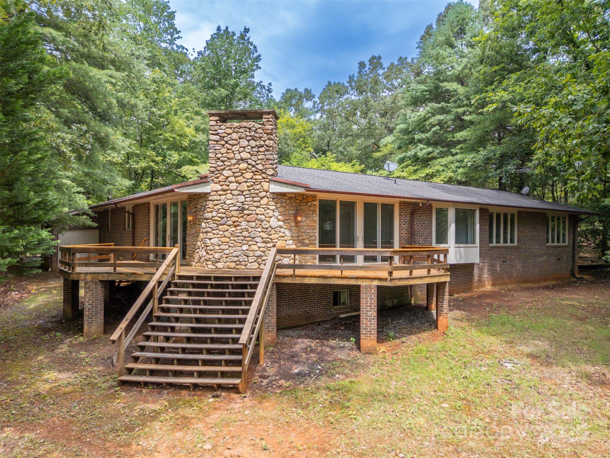106 Bluebird Lane Tryon, NC 28782 - Photo 23 of 26 a view of a patio with a table and chairs