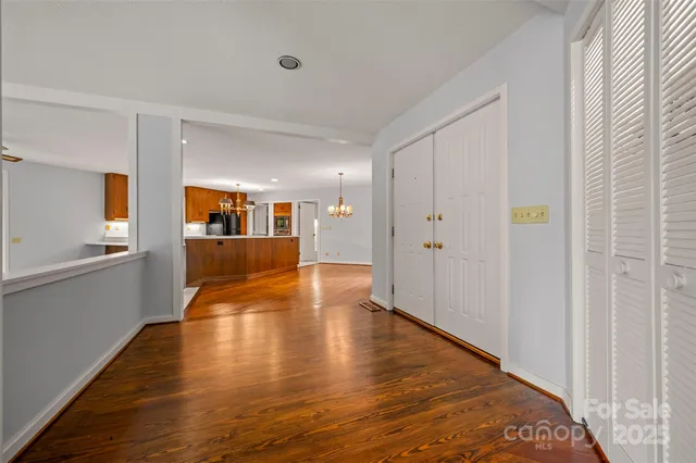 a view of a living room with wooden floor