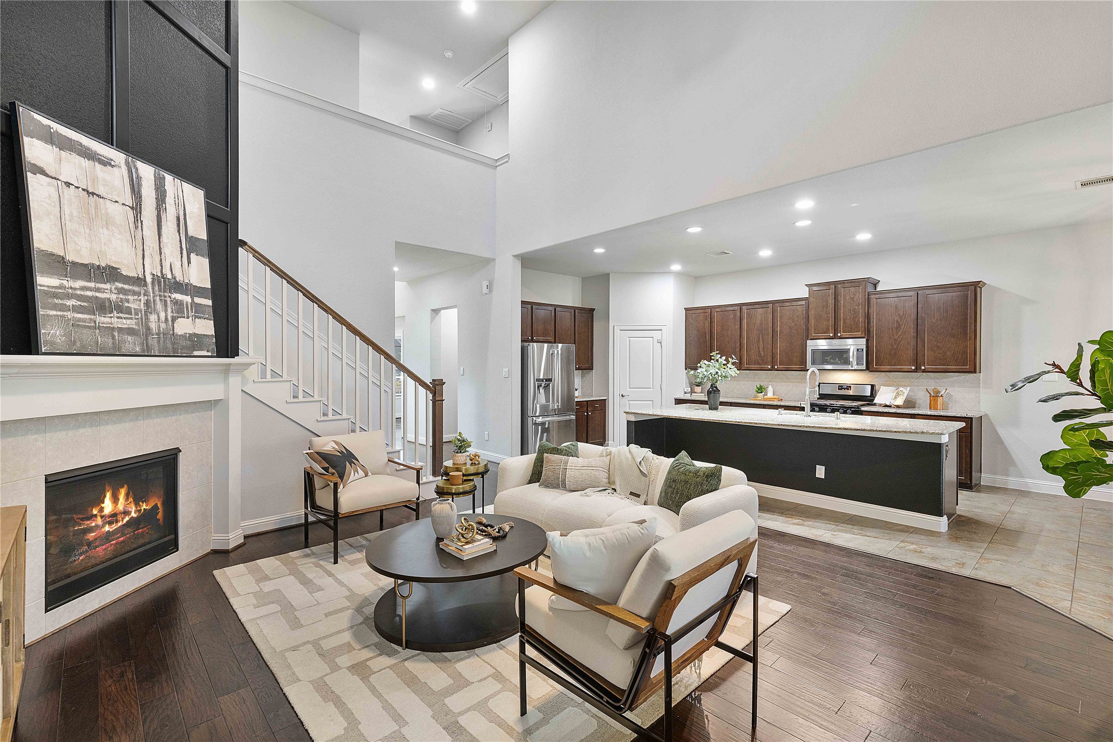 29539 Monona Terrace Court Spring, TX 77386 - Photo 15 of 50 The kitchen is just off the living room, creating an open space with room for entertaining. Perfect for family events, holidays, and more! *Staged furniture and accessories do not convey with the home*