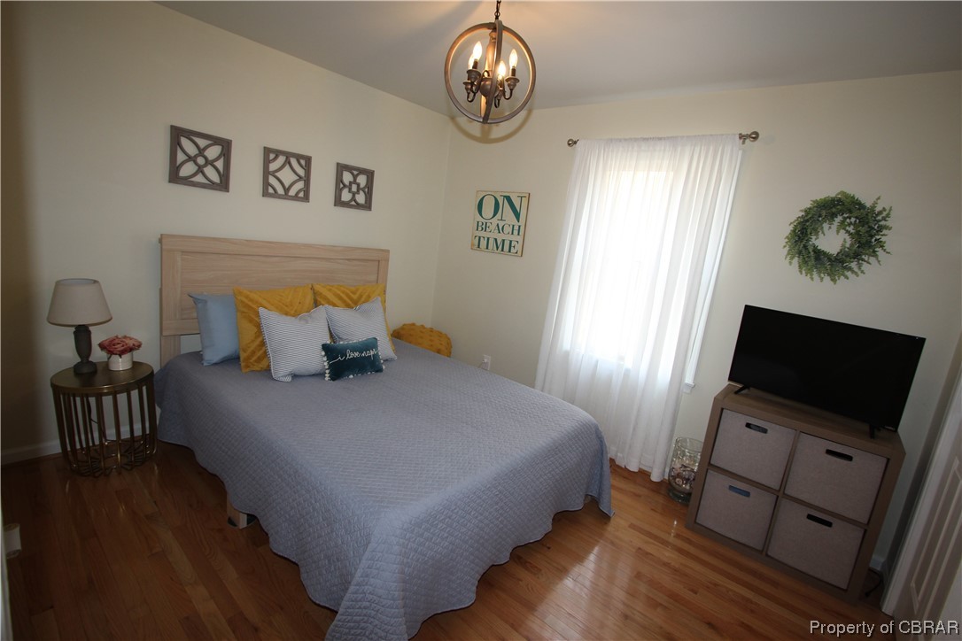 939 Long Road Mathews, VA 23109 - Photo 30 of 50 a bedroom with bed tv and window