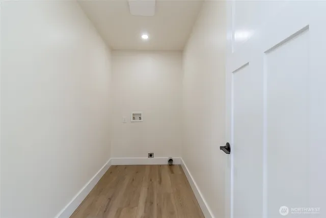 a view of staircase with white walls and windows