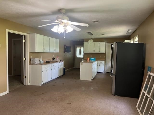 170 Ivy Lane Adamsville, TN 38310 - Photo 13 of 34 a kitchen with cabinets and stainless steel appliances