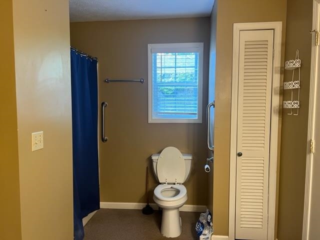 170 Ivy Lane Adamsville, TN 38310 - Photo 18 of 34 a bathroom with a toilet and a shower