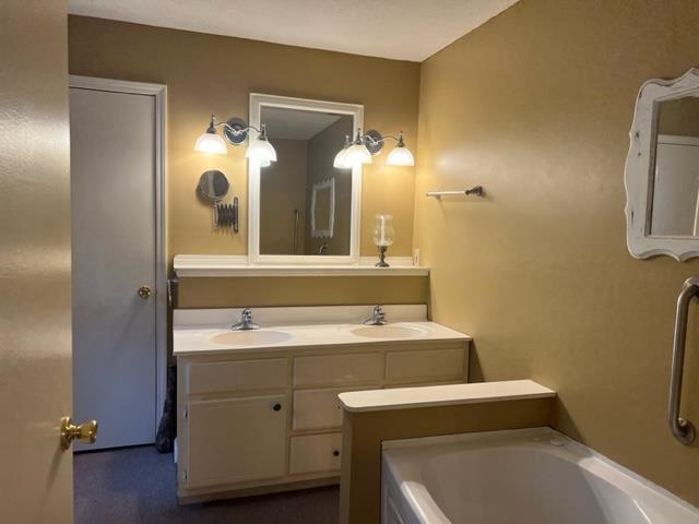 170 Ivy Lane Adamsville, TN 38310 - Photo 19 of 34 a bathroom with a sink and a mirror