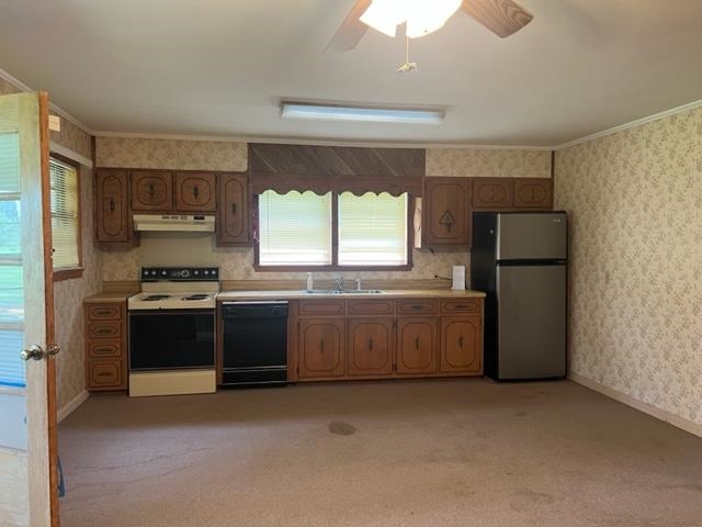 170 Ivy Lane Adamsville, TN 38310 - Photo 2 of 34 a kitchen with a refrigerator and a stove top oven