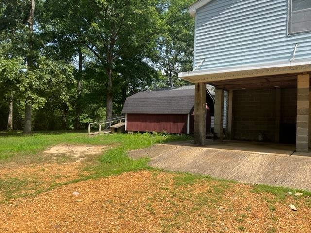 170 Ivy Lane Adamsville, TN 38310 - Photo 22 of 34 a front view of a house with a yard