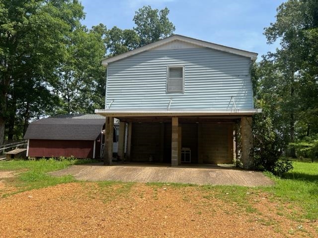 170 Ivy Lane Adamsville, TN 38310 - Photo 23 of 34 a view of a house with a yard