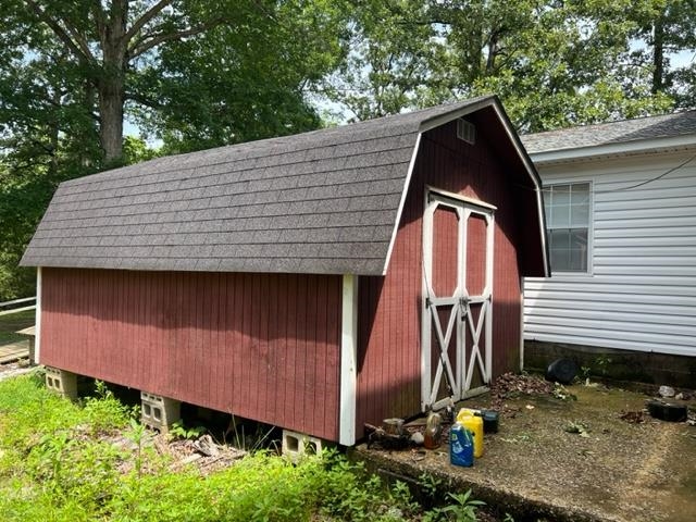 170 Ivy Lane Adamsville, TN 38310 - Photo 25 of 34 a view of a small house with entertaining space