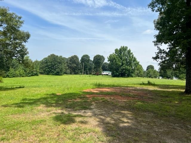 170 Ivy Lane Adamsville, TN 38310 - Photo 32 of 34 a view of a green field with wooden fence