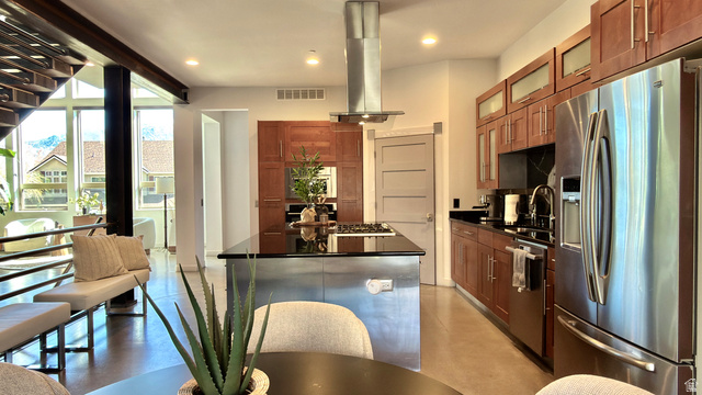 14902 Saddle Leaf Court Draper, UT 84020 - Photo 14 of 52 Kitchen with stainless steel appliances, glass fronted cabinets, a center island, island exhaust hood, and wood finish cabinetry