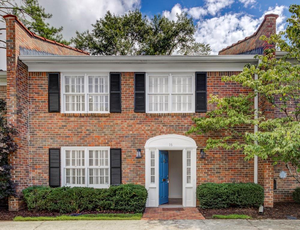 a front view of a house with yard
