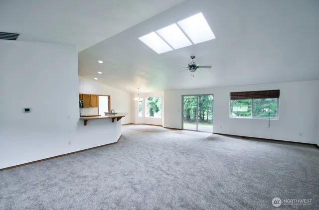 an empty room with windows and entrance