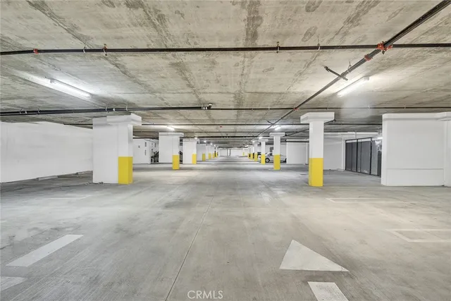 a large white kitchen with a sink and cabinets