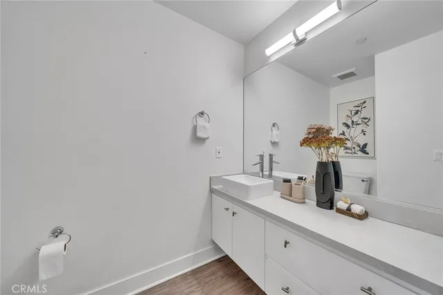 a spacious bedroom with a bed and a couch