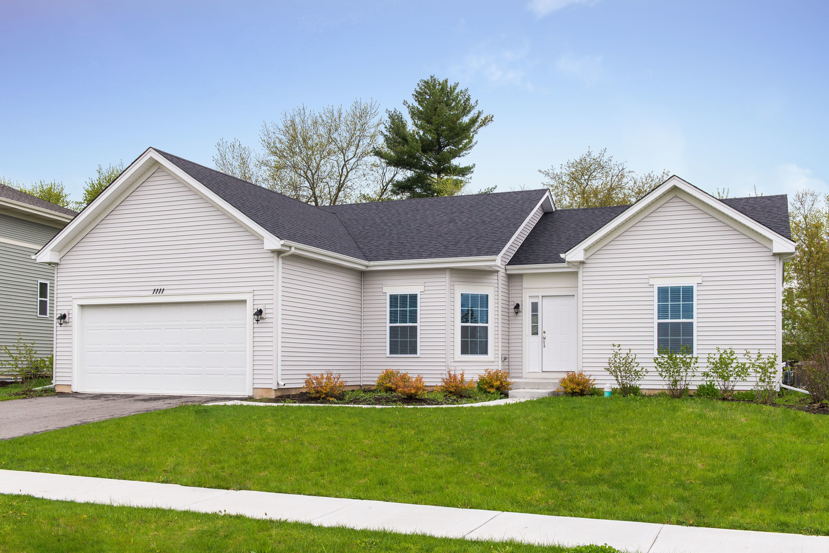1111 Bailey Road Sycamore, IL 60178 - Photo 2 of 32 a front view of house with yard and green space