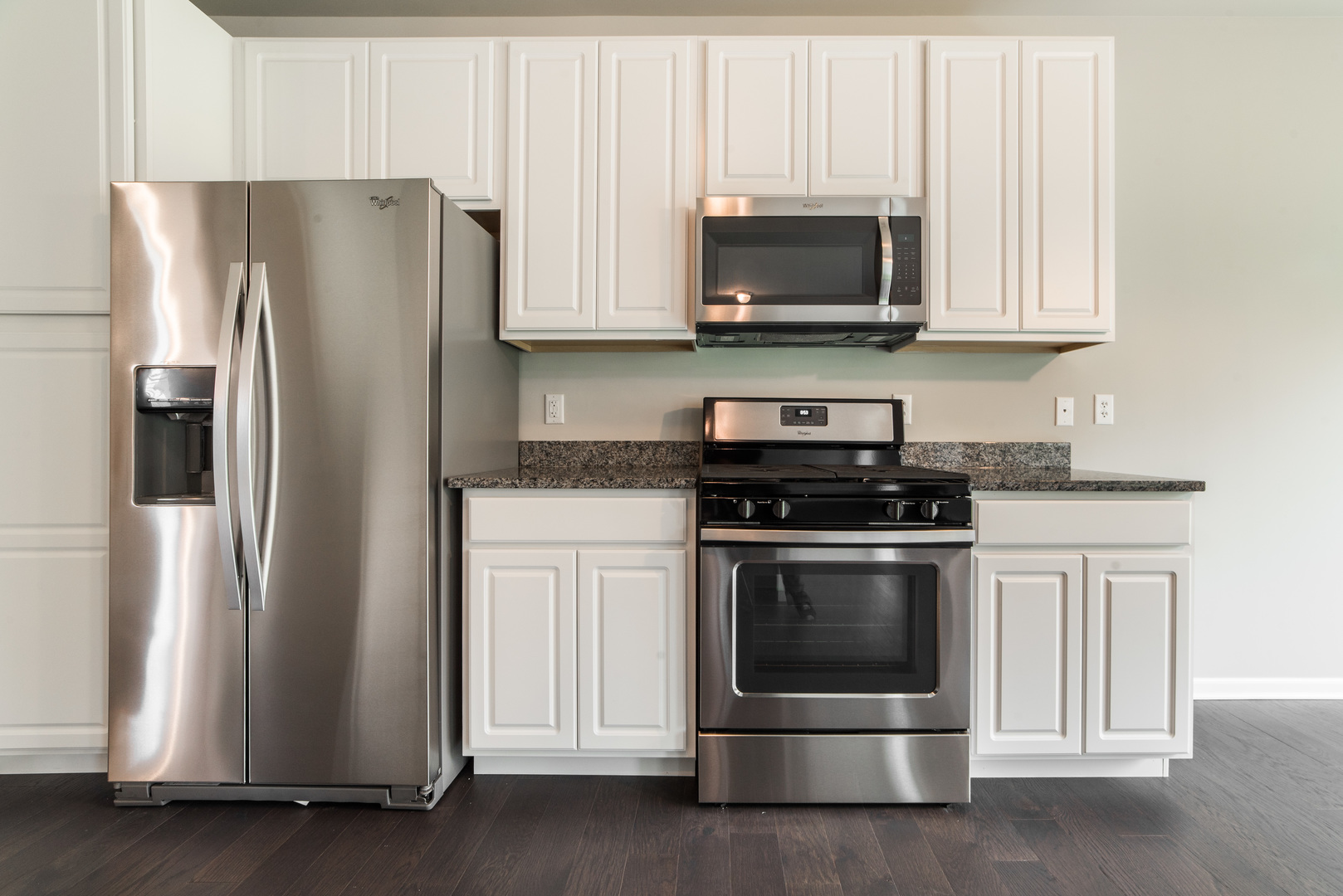 1111 Bailey Road Sycamore, IL 60178 - Photo 11 of 32 a kitchen with stainless steel appliances granite countertop a refrigerator stove and microwave
