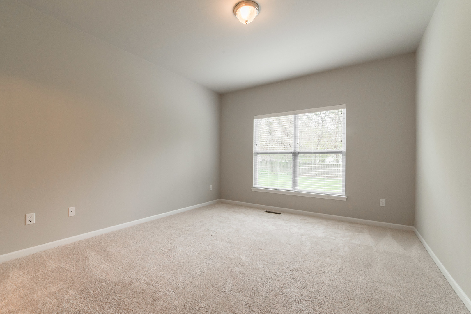 1111 Bailey Road Sycamore, IL 60178 - Photo 13 of 32 an empty room with a window