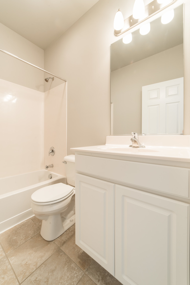 1111 Bailey Road Sycamore, IL 60178 - Photo 25 of 32 a bathroom with a sink a toilet and shower
