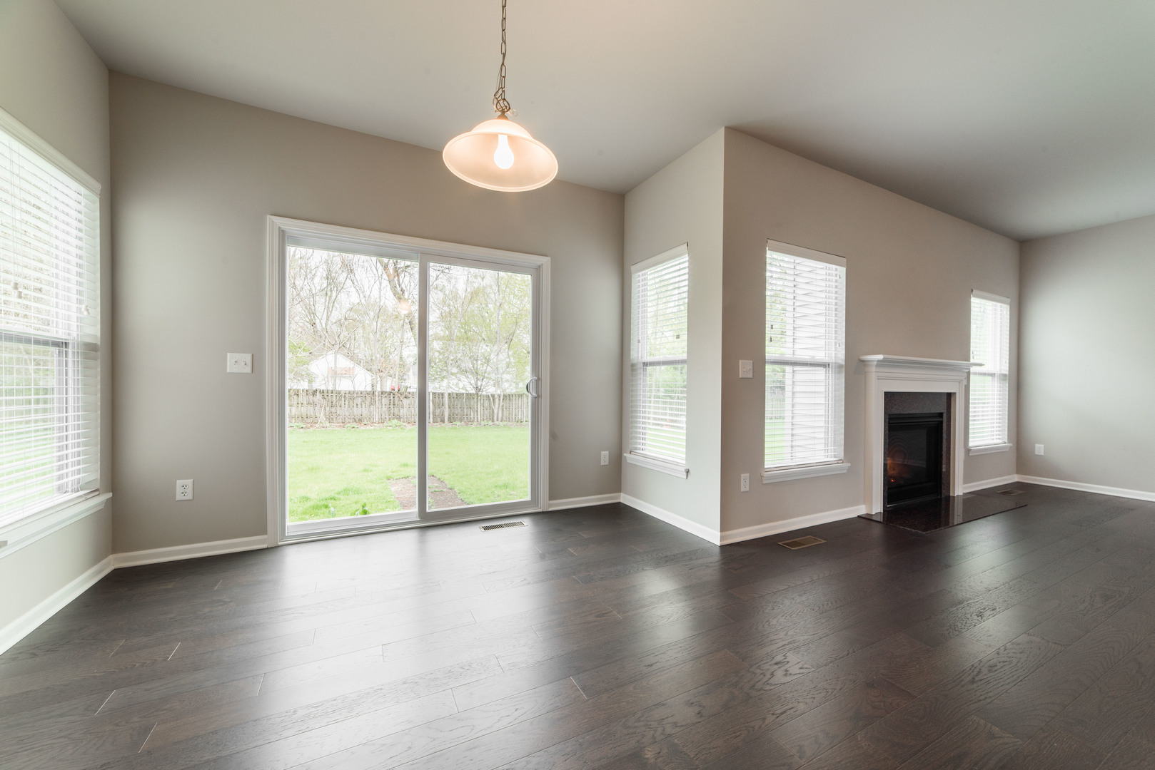 1111 Bailey Road Sycamore, IL 60178 - Photo 8 of 32 a view of an empty room with wooden floor and a window
