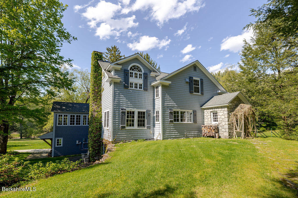 17 Cronk Road Monterey, MA 01245 - Photo 72 of 79 a front view of a house with a yard and garage