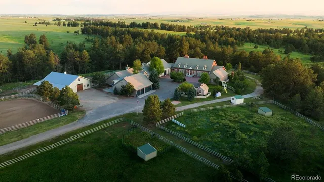 a view of a table and chairs in the garden