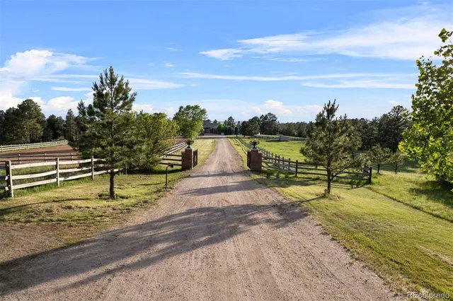 an aerial view of residential house with outdoor space