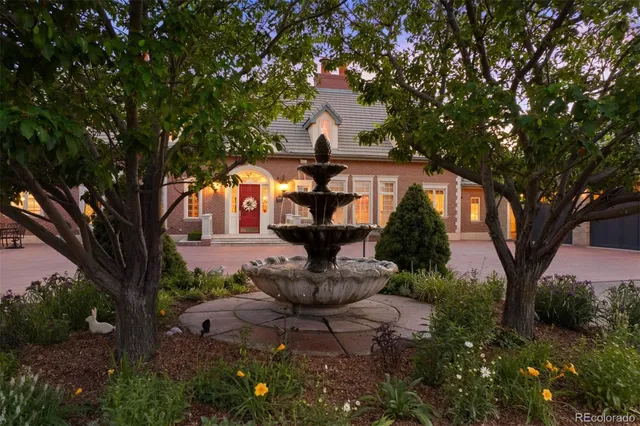 a view of a fountain in the middle of a garden