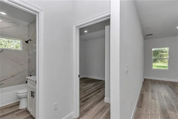 a view of bathroom with a toilet sink and a bathtub