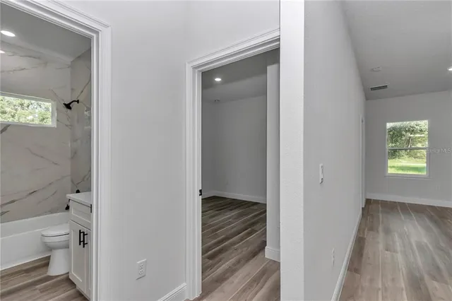 a view of bathroom with a toilet sink and a bathtub