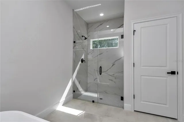 a bathroom with a shower and toilet