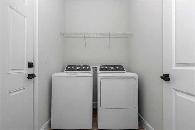 a utility room with dryer and washer
