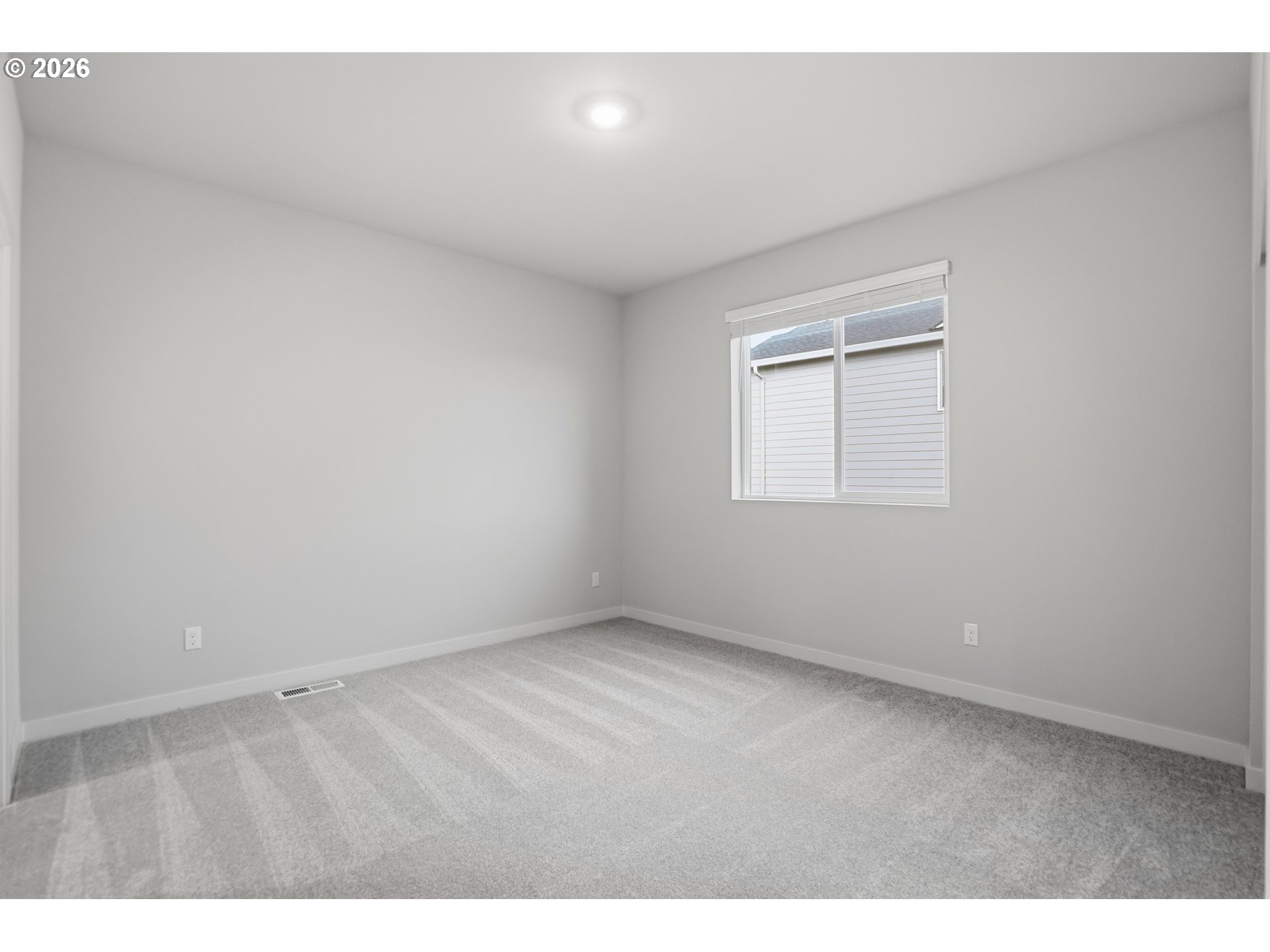 5514 North 88th Avenue Camas, WA 98607 - Photo 17 of 17 a view of an empty room with a window