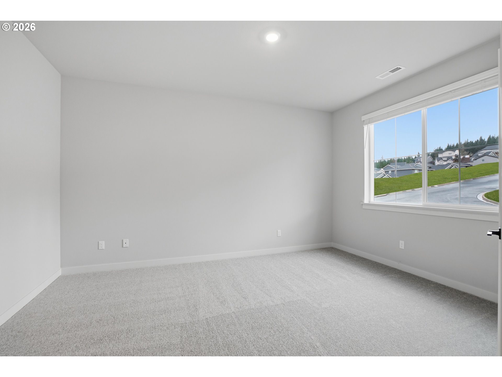 5514 North 88th Avenue Camas, WA 98607 - Photo 9 of 17 a view of an empty room and a window