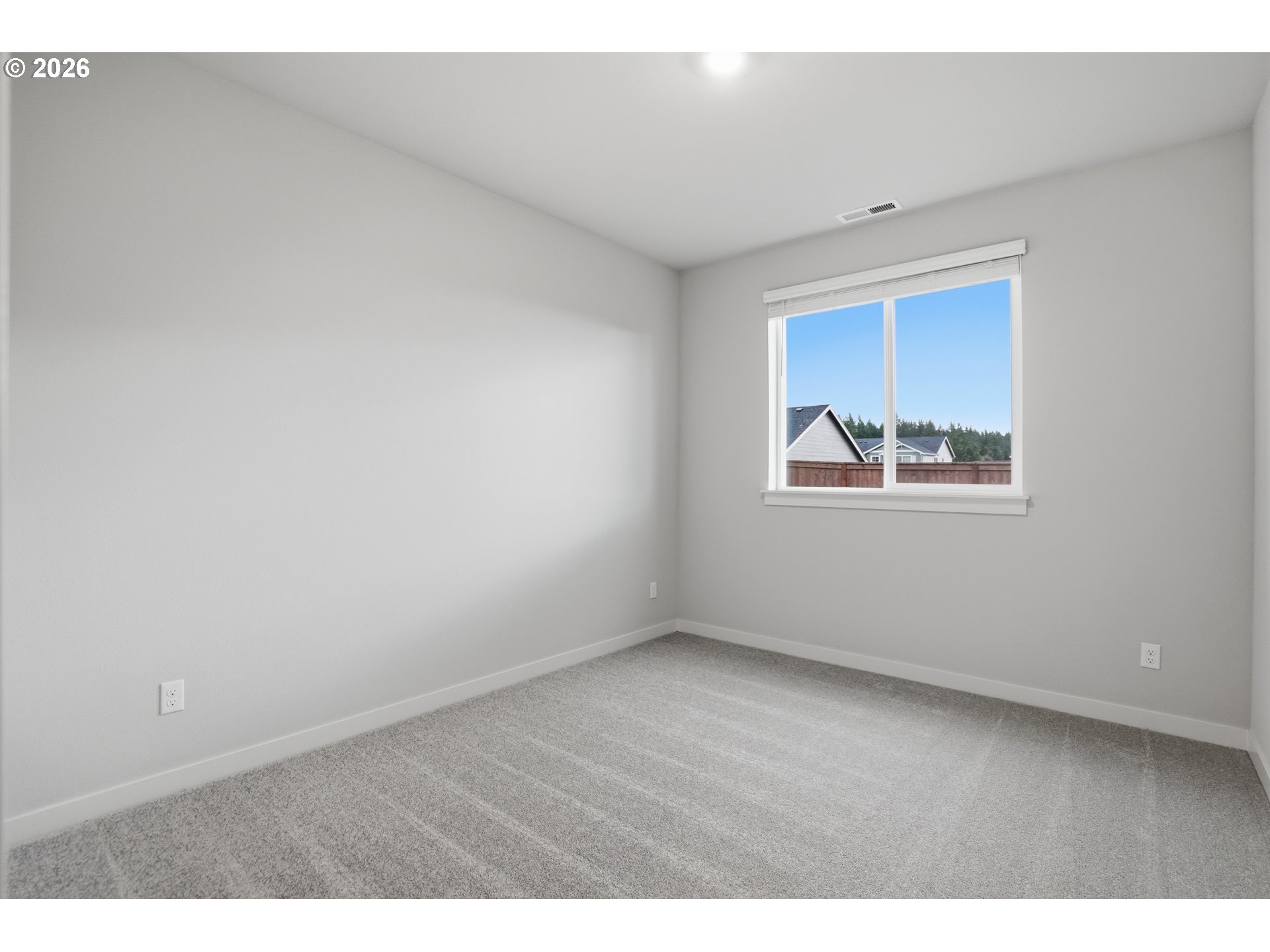5514 North 88th Avenue Camas, WA 98607 - Photo 10 of 17 a view of an empty room with a window