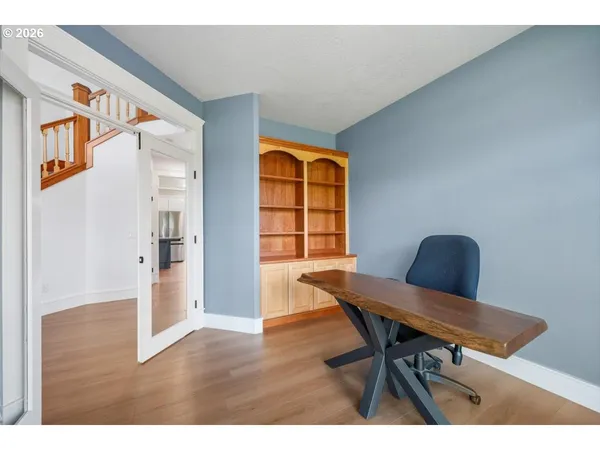 a workspace with furniture and wooden floor