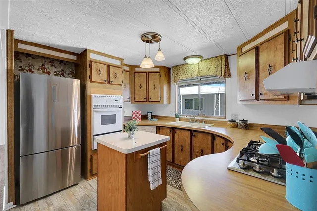 a view of kitchen with furniture and wooden floor