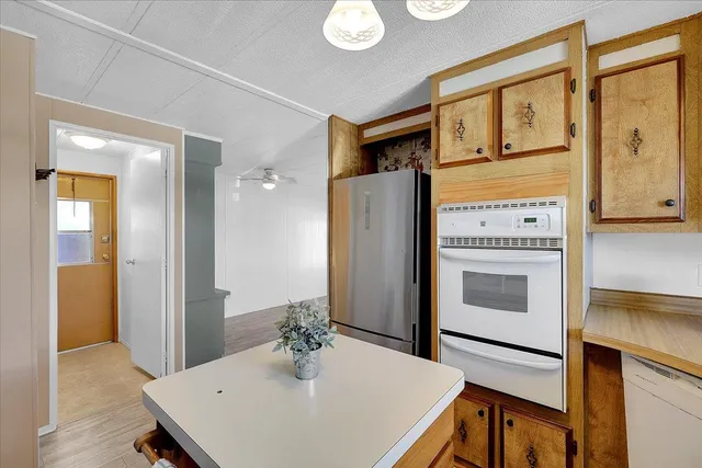 a kitchen that has a cabinets and a stove