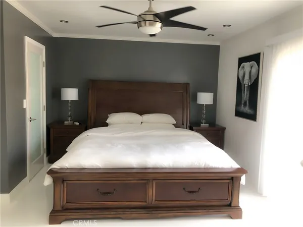 a bedroom with a bed and a table